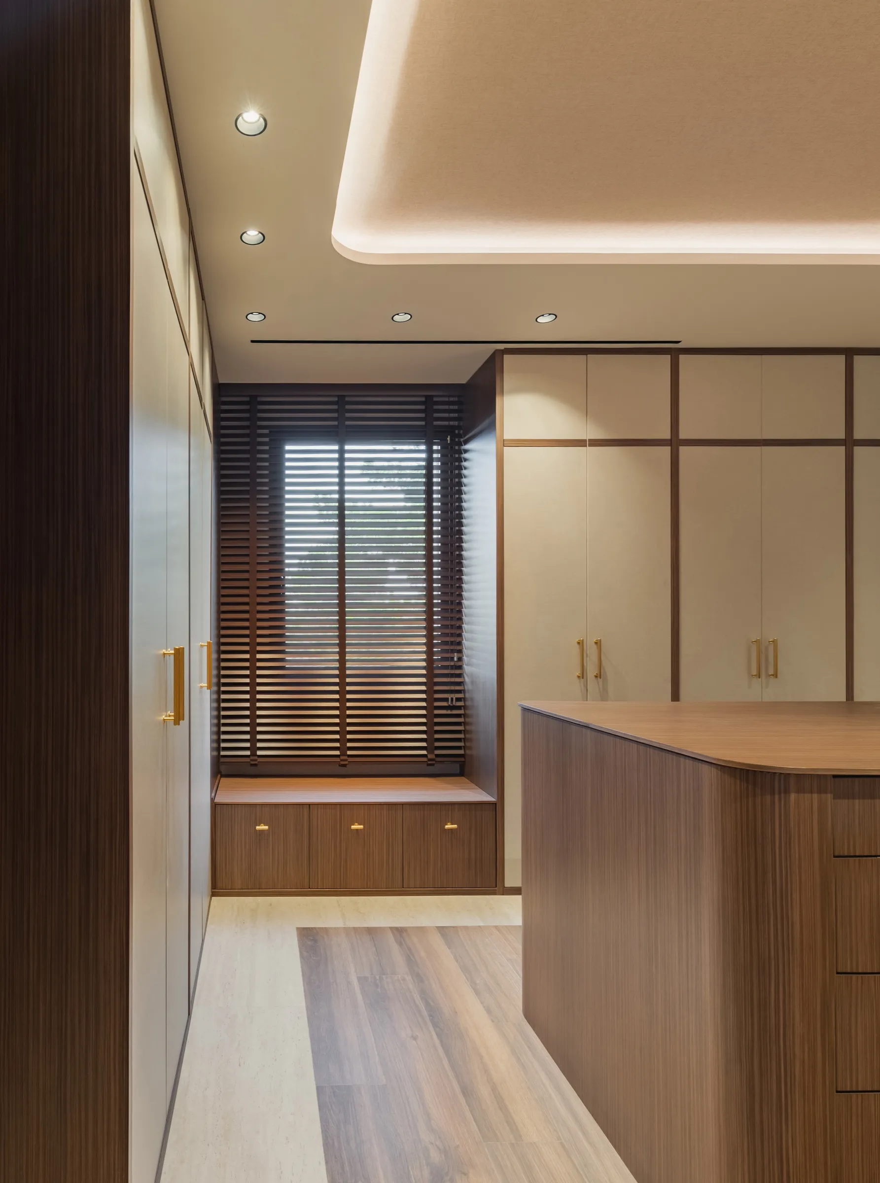 Closet wardrobes with integrated bench under the window